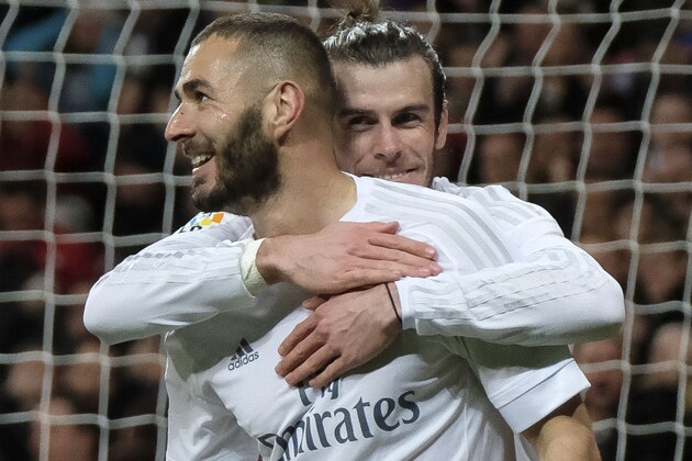 Real Madrid's Welsh forward Gareth Bale (R) and Real Madrid's French forward Karim Benzema (L) celebrate a scoring during the Spanish league football match Real Madrid CF vs Sevilla FC at the Santiago Bernabeu stadium in Madrid on March 20, 2016. / AFP / PEDRO ARMESTRE        (Photo credit should read PEDRO ARMESTRE/AFP/Getty Images)