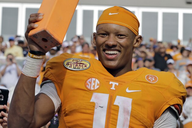 Tennessee quarterback Joshua Dobbs smiles as he holds a pylon after their 45-6 win over Northwestern in the Outback Bowl NCAA college football game Friday, Jan. 1, 2016, in Tampa, Fla. (AP Photo/Chris O'Meara)