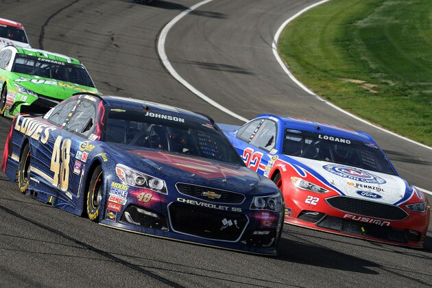 Jimmie Johnson (48) and Joey Logana (22) race for the lead during the late laps of the NASCAR 400 mile auto race Sunday, March 20, 2016, at Auto Club Speedway in Fontana, Calif. (AP Photo/Will Lester)