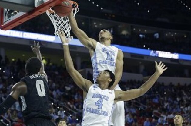 North Carolina forward Brice Johnson (11) blocks a shot by Providence forward Ben Bentil (0) during the second half of a second-round men's college basketball game in the NCAA Tournament, Saturday, March 19, 2016, in Raleigh, N.C. (AP Photo/Gerry Broome)