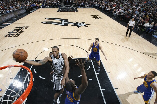 SAN ANTONIO, TX - MARCH 19:  Kawhi Leonard #2 of the San Antonio Spurs goes to the basket against the Golden State Warriors on March 19, 2016 at the AT&T Center in San Antonio, Texas. NOTE TO USER: User expressly acknowledges and agrees that, by downloading and or using this photograph, user is consenting to the terms and conditions of the Getty Images License Agreement. Mandatory Copyright Notice: Copyright 2016 NBAE (Photos by Chris Covatta/NBAE via Getty Images)