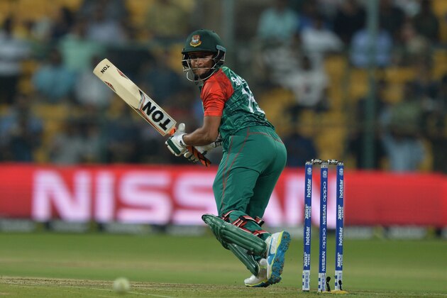 Bangladesh batsman Shakib Al Hasan plays a shot during the World T20 cricket tournament match between Australia and Bangladesh at The Chinnaswamy Stadium in Bangalore on March 21, 2016. / AFP / MANJUNATH KIRAN        (Photo credit should read MANJUNATH KIRAN/AFP/Getty Images)