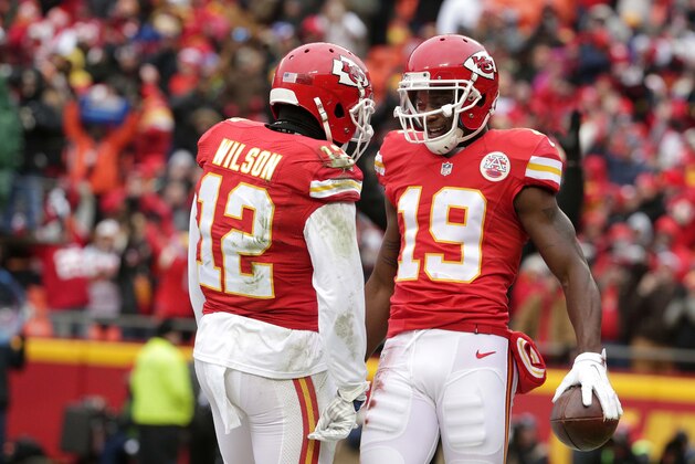 Kansas City Chiefs wide receiver Jeremy Maclin (19) celebrates his touchdown catch with wide receiver Albert Wilson (12) during the first half of an NFL football game against the Cleveland Browns in Kansas City, Mo., Sunday, Dec. 27, 2015. (AP Photo/Charlie Riedel)