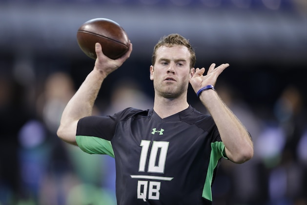 Stanford quarterback Kevin Hogan runs a drill at the NFL football scouting combine on Saturday, Feb. 27, 2016, in Indianapolis. (AP Photo/Darron Cummings)