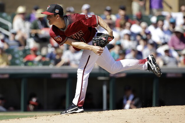 Arizona Diamondbacks' Zack Greinke throws during a spring training baseball game against the Seattle Mariners in Scottsdale, Ariz., Monday, March 14, 2016. (AP Photo/Jeff Chiu)