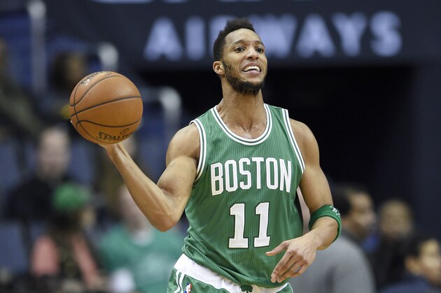 Boston Celtics guard Evan Turner (11) handles the ball during the first half of an NBA basketball game against the Washington Wizards, Monday, Jan. 25, 2016, in Washington. (AP Photo/Nick Wass)