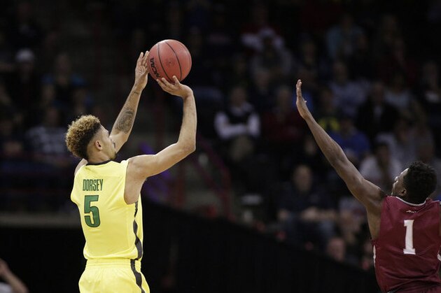 Oregon guard Tyler Dorsey (5) shoots against Saint Joseph's guard Shavar Newkirk (1) during the second half of a second-round men's college basketball game in the NCAA Tournament in Spokane, Wash., Sunday, March 20, 2016. (AP Photo/Young Kwak)