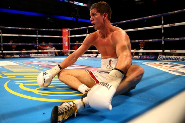 LONDON, ENGLAND - DECEMBER 12:  Luke Campbell sits on the canvas after being put down by Yvan Mendy in the WBC International Lightweight Championship fight during the Matchroom Boxing promotion 'Bad Intentions' at The O2 Arena on December 12, 2015 in London, England.  (Photo by Richard Heathcote/Getty Images)