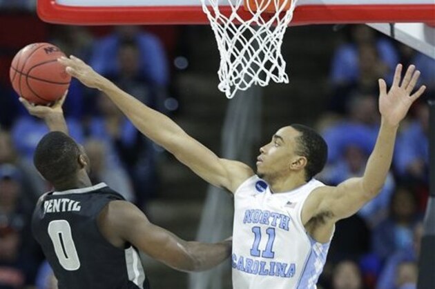 North Carolina forward Brice Johnson (11) blocks the shot of Providence forward Ben Bentil (0) during the second half of a second-round men's college basketball game in the NCAA Tournament, Saturday, March 19, 2016, in Raleigh, N.C. (AP Photo/Chuck Burton)