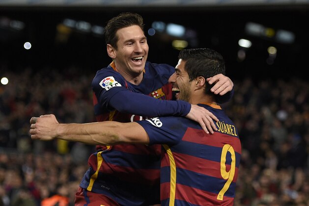 TOPSHOT - Barcelona's Uruguayan forward Luis Suarez (R) celebrates a goal with Barcelona's Argentinian forward Lionel Messi during the Spanish league football match FC Barcelona vs RC Celta de Vigo at the Camp Nou stadium in Barcelona on February 14, 2016.

 / AFP / LLUIS GENE        (Photo credit should read LLUIS GENE/AFP/Getty Images)