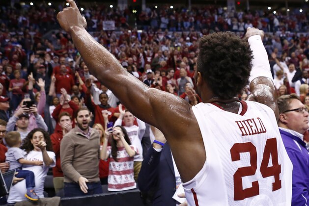 Oklahoma guard Buddy Hield (24) gestures to the Oklahoma crowd following a second-round men's college basketball game in the NCAA Tournament Sunday, March 20, 2016, in Oklahoma City. Oklahoma won 85-81. (AP Photo/Alonzo Adams)