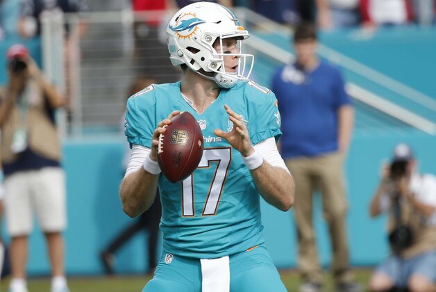 Miami Dolphins quarterback Ryan Tannehill (17) looks to pass during the first half of an NFL football game against the New England Patriots, Sunday, Jan. 3, 2016 in Miami Gardens, Fla. (AP Photo/Wilfredo Lee)
