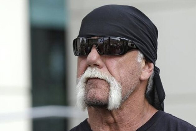 FILE - In this Oct. 15, 2012, file photo, reality TV star and former pro wrestler Hulk Hogan, whose real name is Terry Bollea, looks on as his attorney speaks during a news at the United States Courthouse in Tampa, Fla. A Florida judge has rejected motions for a group of media outlets asking to make records in the Hulk Hogan sex video case public. Hogan is suing the news website Gawker for posting a video of him having sex with a woman who at the time was married to his friend. (AP Photo/Chris O'Meara, File)