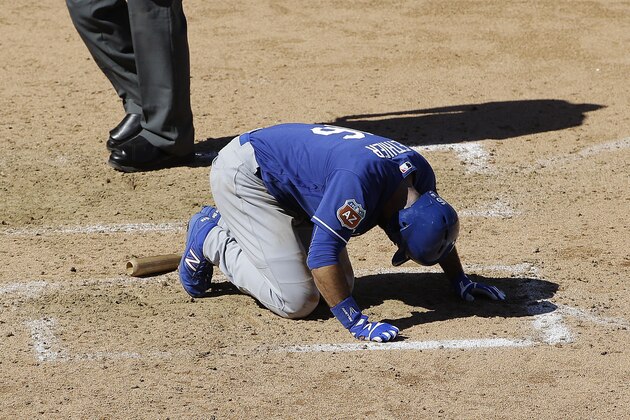Los Angeles Dodgers' Andre Ethier remains on the ground during the fourth inning of a spring training baseball game against the Arizona Diamondbacks in Scottsdale, Ariz., Friday, March 18, 2016. Ethier left the game after reaching first base on a walk. (AP Photo/Jeff Chiu)