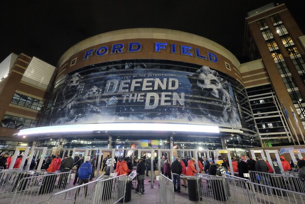 Football fans wait to enter Ford Field for an NFL football game between the Detroit Lions and the Green Bay Packers, Thursday, Dec. 3, 2015, in Detroit. (AP Photo/Rick Osentoski)