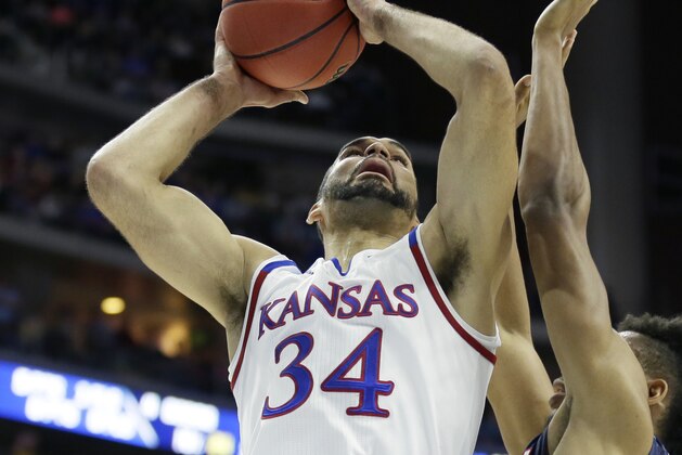 Kansas forward Perry Ellis shoots over Connecticut forward Shonn Miller, right, during the first half of a second-round men's college basketball game in the NCAA Tournament, Saturday, March 19, 2016, in Des Moines, Iowa. (AP Photo/Charlie Neibergall)