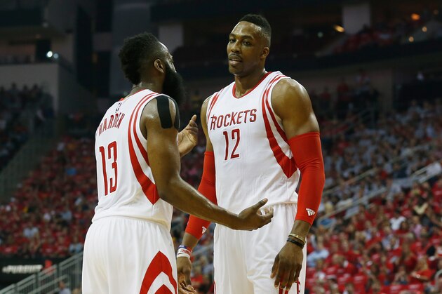 HOUSTON, TX - MAY 04:  James Harden #13 and Dwight Howard #12 of the Houston Rockets dicuss a play against the Los Angeles Clippers during Game One in the Western Conference Semifinals of the 2015 NBA Playoffs on May 4, 2015 at the Toyota Center in Houston, Texas. NOTE TO USER: User expressly acknowledges and agrees that, by downloading and/or using this photograph, user is consenting to the terms and conditions of the Getty Images License Agreement.  (Photo by Scott Halleran/Getty Images)