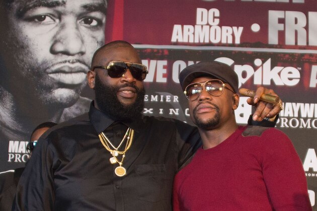 US Hip Hop artist Rick Ross (L) poses with promoter and former champion boxer Floyd Mayweather during a press conference announcing the fight between WBA super lightweight champion Adrien Broner and Ashley Theophane in Washington, DC, February 29, 2016.   
The title contest is scheduled to take place April 1, 2016 at the D.C. Armory in Washington DC. / AFP / JIM WATSON        (Photo credit should read JIM WATSON/AFP/Getty Images)
