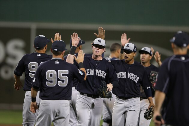 FORT MYERS, FL - MARCH 15: Nick Rumbelow #50 of the New York Yankees celebrates a win over the Boston Red Sox with his teammate on March 15, 2016 during the Spring Training Game at Jet Blue Park at Fenway South, Fort Myers, Florida. The Yankees defeated the Red Sox 6-3. (Photo by Leon Halip/Getty Images)