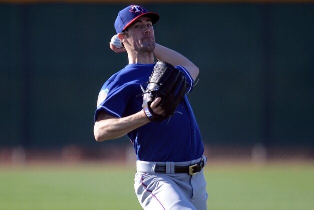 Feb 21, 2016; Surprise, AZ, USA; Texas Rangers starting pitcher Cole Hamels (35) throws during a workout at Surprise Stadium Practice Fields. Mandatory Credit: Joe Camporeale-USA TODAY Sports