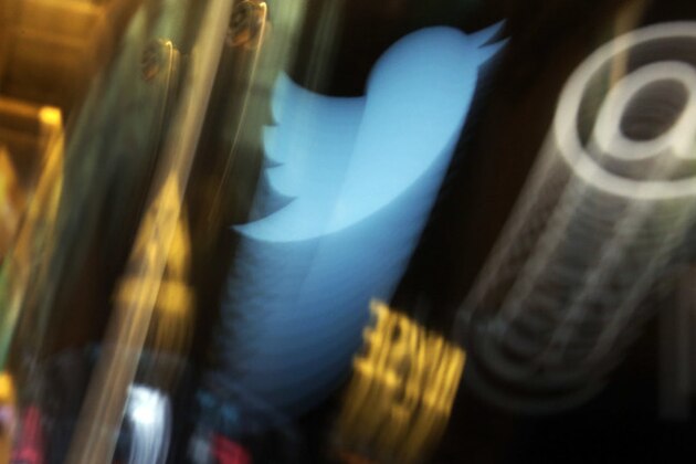 FILE - In this Wednesday Nov. 6, 2013, file photo, the Twitter logo appears on an updated phone post on the floor of the New York Stock Exchange. Twitter, the social media site famous for its 140-character “tweet” limit, turned 10 years old Monday, March 21, 2016, having evolved from what was originally billed as a “microblogging” site into one of the Internet's most influential means of communication. (AP Photo/Richard Drew, File)
