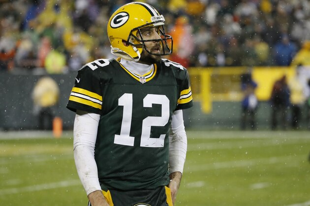 Green Bay Packers' Aaron Rodgers walks off the field after failing to complete on fourth down in the final seconds of an NFL football game against the Chicago Bears Thursday, Nov. 26, 2015, in Green Bay, Wis. The Bears won 17-13. (AP Photo/Morry Gash)