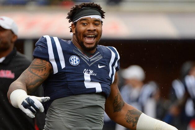 Mississippi defensive tackle Robert Nkemdiche (5) stretches before an NCAA college football game between Mississippi and Arkansas in Oxford, Miss., Saturday, Nov. 7, 2015. (AP Photo/Thomas Graning)