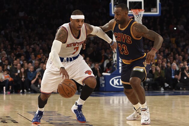 New York Knicks forward Carmelo Anthony (7) drives the ball past Cleveland Cavaliers forward LeBron James (23) during the second half of an NBA basketball game on Friday, Nov. 13, 2015, in New York. The Cavaliers won 90-84. (AP Photo/Kathy Kmonicek)