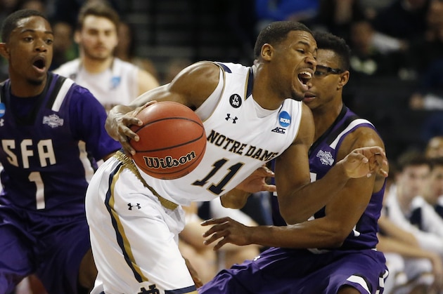 Notre Dame guard Demetrius Jackson (11) reacts as he drives past Stephen F. Austin guard Trey Pinkney (10) during the second half of a second-round NCAA men's college basketball tournament game, Sunday, March 20, 2016, in New York.  (AP Photo/Kathy Willens)