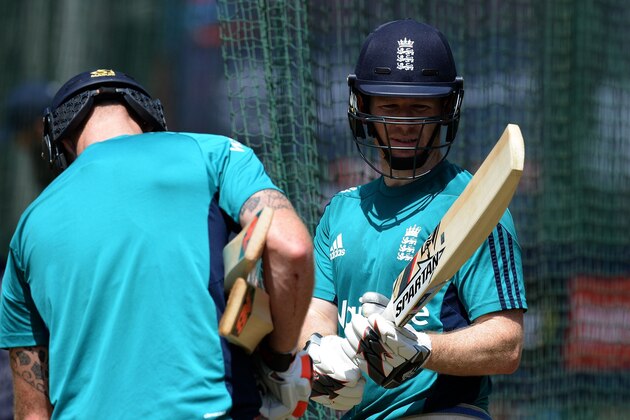 England's captain Eoin Morgan (R) talks with a teammate during training session at Feroj Shah Kotla cricket ground in New Delhi on March 21, 2016.
England will play their World T20 cricket match against Afghanistan on March 23, 2016.
 / AFP / PRAKASH SINGH        (Photo credit should read PRAKASH SINGH/AFP/Getty Images)