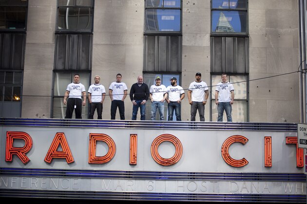 NEW YORK - MARCH 06:   UFC president Dana White (4L) poses with fighters Pat Barry (L), Josh Koscheck (2L), Nate Diaz (3L),  Jim Miller (4R), Johny Hendricks (3R), Lavar Johnson (2R) and Alan Belcher (R) on top of the Radio City Music Hall marquee before a press conference on March 06, 2012 in New York City.  UFC announced that their third event on the FOX network will take place on Saturday, May 5 from the IZOD Center in East Rutherford, N.J.. (Photo by Michael Nagle/Getty Images)