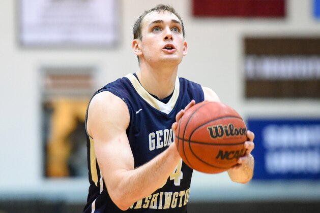 Feb 13, 2016; St. Bonaventure, NY, USA; George Washington Colonials forward Tyler Cavanaugh (34) shoots a free throw against the St. Bonaventure Bonnies during the second half at the Reilly Center.  St. Bonaventure defeated George Washington 64-57.  Mandatory Credit: Rich Barnes-USA TODAY Sports