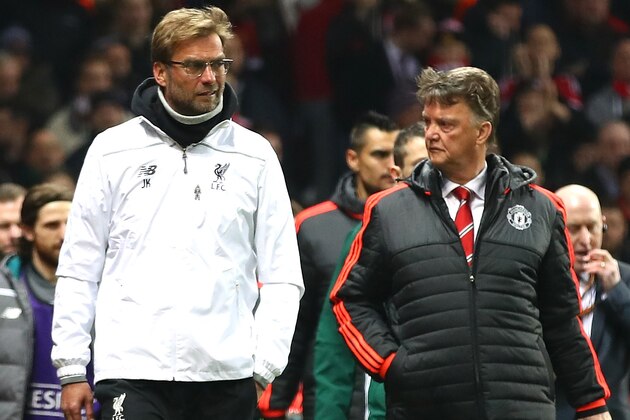 MANCHESTER, ENGLAND - MARCH 17:  Louis van Gaal Manager of Manchester United and Jurgen Klopp manager of Liverpool walk along the touchline prior to the UEFA Europa League round of 16, second leg match between Manchester United and Liverpool at Old Trafford on March 17, 2016 in Manchester, England.  (Photo by Clive Brunskill/Getty Images)