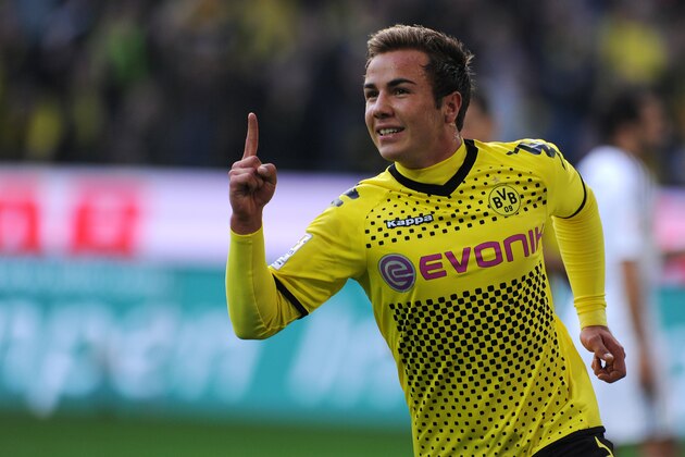 Dortmund's midfielder Mario Goetze celebrates scoring during the German first division Bundesliga football match Borussia Dortmund vs VfL Wolfsburg in the western German city of Dortmund on November 5, 2011. AFP PHOTO / PATRIK STOLLARZ

 +++ RESTRICTIONS / EMBARGO - DFL LIMITS THE USE OF IMAGES ON THE INTERNET TO 15 PICTURES (NO VIDEO-LIKE SEQUENCES) DURING THE MATCH AND PROHIBITS MOBILE (MMS) USE DURING AND FOR FURTHER TWO HOURS AFTER THE MATCH. FOR MORE INFORMATION CONTACT DFL. (Photo credit should read PATRIK STOLLARZ/AFP/Getty Images)