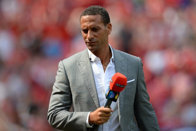 Former Manchester United defender Rio Ferdinand, working as a Television pundit is pictured ahead of the English Premier League football match between Manchester United and Tottenham Hotspur at Old Trafford in Manchester, north west England, on August 8, 2015. AFP PHOTO / OLI SCARFF

RESTRICTED TO EDITORIAL USE. No use with unauthorized audio, video, data, fixture lists, club/league logos or 'live' services. Online in-match use limited to 75 images, no video emulation. No use in betting, games or single club/league/player publications.        (Photo credit should read OLI SCARFF/AFP/Getty Images)