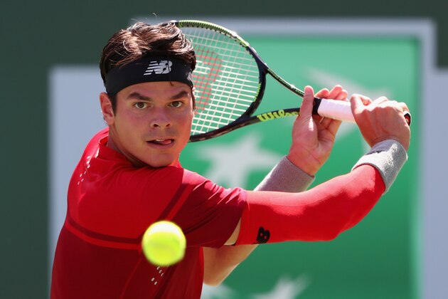 INDIAN WELLS, CA - MARCH 19:  Milos Raonic of Canada in action against David Goffin of Belgium in the semi finals during day thirteen of the BNP Paribas Open at Indian Wells Tennis Garden on March 19, 2016 in Indian Wells, California.  (Photo by Julian Finney/Getty Images)