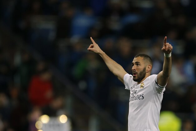 Real Madrid 's Karim Benzema celebrates after scoring the opening goal against Sevilla during a Spanish La Liga soccer match between Real Madrid and Sevilla at the Santiago Bernabeu stadium, in Madrid, Sunday, March 20, 2016. (AP Photo/Francisco Seco)