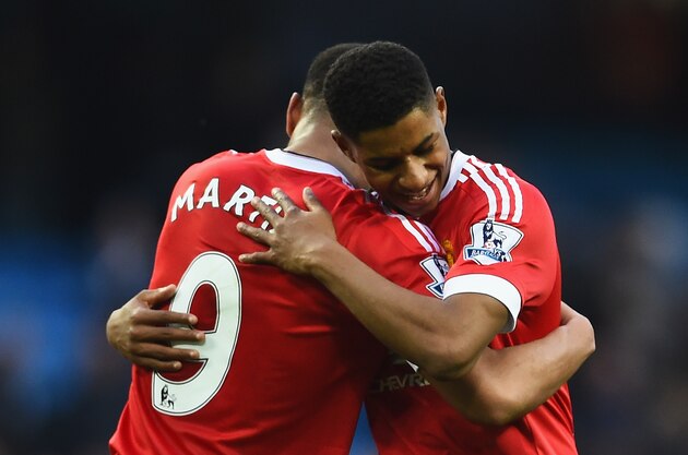 MANCHESTER, ENGLAND - MARCH 20:  Winning goalscorer Marcus Rashford of Manchester United (R) and team mates Anthony Martial (C) and Timothy Fosu-Mensah celebrate victory after the Barclays Premier League match between Manchester City and Manchester United at Etihad Stadium on March 20, 2016 in Manchester, United Kingdom.  (Photo by Laurence Griffiths/Getty Images)