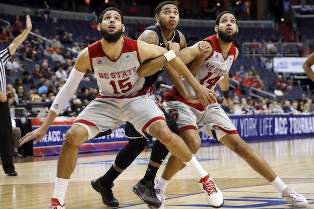 Brothers North Carolina State guard Cody Martin (15) and North Carolina State guard Caleb Martin (14) work to box out Wake Forest guard Rondale Watson (23) during the second half of an NCAA college basketball game in the Atlantic Coast Conference tournament, Tuesday, March 8, 2016, in Washington. NC State won 75-72. (AP Photo/Alex Brandon) Brothers North Carolina State guard Cody Martin (15) and North Carolina State guard Caleb Martin (14) work to box out Wake Forest guard Rondale Watson (23) during the second half of an NCAA college basketball game in the Atlantic Coast Conference tournament, Tuesday, March 8, 2016, in Washington. NC State won 75-72. (AP Photo/Alex Brandon)