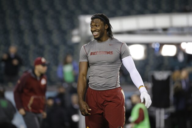 Washington Redskins' Robert Griffin III smiles during warm-ups before an NFL football game against the Philadelphia Eagles, Saturday, Dec. 26, 2015, in Philadelphia.  (AP Photo/Michael Perez)