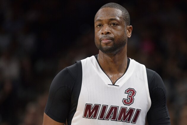 Miami Heat guard Dwyane Wade walks off the court during the first half of an NBA basketball game against the San Antonio Spurs, Wednesday, March 23, 2016, in San Antonio. San Antonio won 112-88. (AP Photo/Darren Abate)