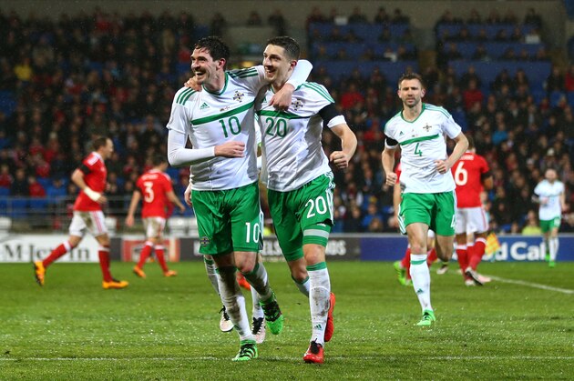CARDIFF, WALES - MARCH 24:  Craig Cathcart #20 of Northern Ireland celebrates with teammate Kyle Rafferty #10 after scoring the opening goal during the international friendly match between Wales and Northern Ireland at the Cardiff City Stadium on March 24, 2016 in Cardiff, Wales.  (Photo by Michael Steele/Getty Images)