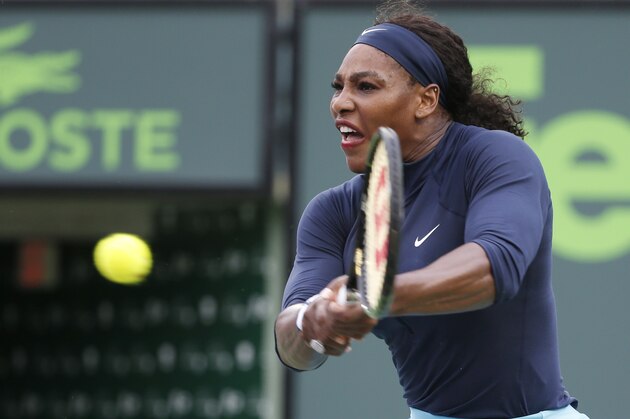 Serena Williams, of the United States, returns a shot from Christina McHale also of the United States, during a match at the Miami Open tennis tournament, in Key Biscayne, Fla., Thursday, March 24, 2016. (AP Photo/Wilfredo Lee)