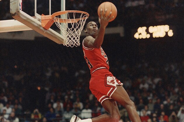 Chicago Bulls’ Michael Jordan dunks the ball during the Slam-Dunk championship in Chicago on Saturday, Feb. 6, 1988 as a part of the NBA All-Star weekend. Jordan edged Atlanta Hawks’ Dominique Wilkins on the final dunk to win the contest. (AP Photo/John Swart)