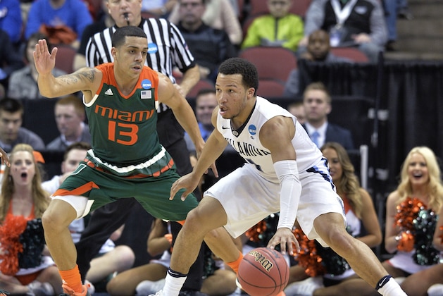 Villanova guard Jalen Brunson (1) looks for help as Miami guard Angel Rodriguez (13) defends during the first half of an NCAA college basketball game in the regional semifinals of the men's NCAA Tournament in Louisville, Ky., Thursday, March 24, 2016. (AP Photo/Timothy D. Easley)