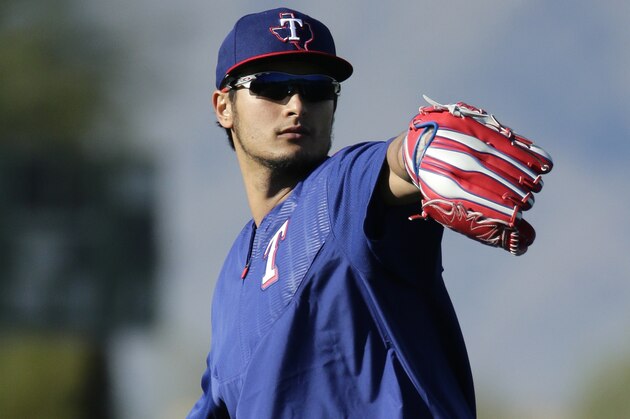 Texas Rangers' pitcher Yu Darvish throws during spring training baseball practice Tuesday, Feb. 23, 2016, in Surprise, Ariz. (AP Photo/Charlie Riedel)