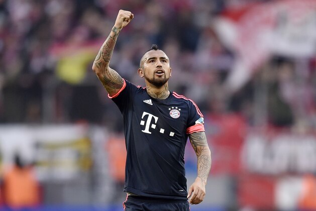 Bayern's Arturo Vidal reacts to supporters after the German Bundesliga soccer match between 1. FC Cologne and Bayern Munich in Cologne, Germany, Saturday, March 19, 2016. Cologne was defeated by Bayern with 0-1. (AP Photo/Martin Meissner)