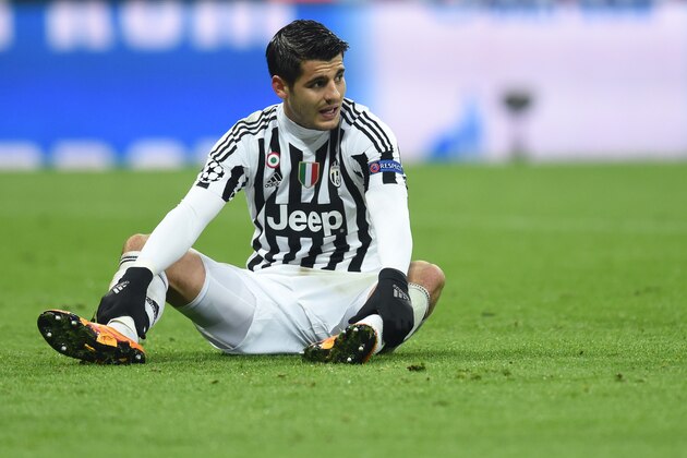 Juventus Spanish striker Alvaro Morata sits at the field during the UEFA Champions League, Round of 16, second leg football match FC Bayern Munich v Juventus in Munich, southern Germany on March 16, 2016. / AFP / CHRISTOF STACHE        (Photo credit should read CHRISTOF STACHE/AFP/Getty Images)