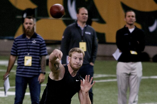 North Dakota State quaerterback Carson Wentz throws a pass during the school's NFL football pro day, Thursday, March 24, 2016, in Fargo, N.D. (AP Photo/Bruce Crummy)