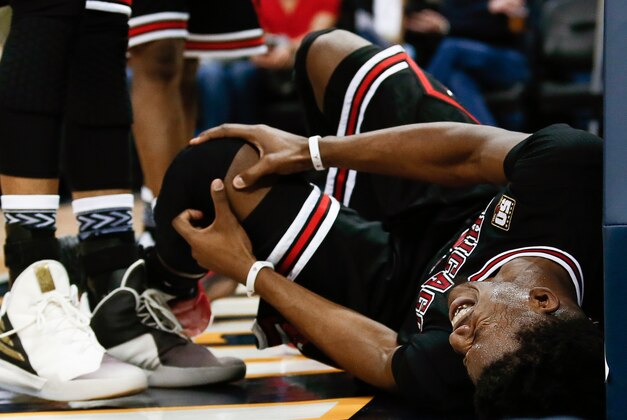 Feb 5, 2016; Denver, CO, USA; Chicago Bulls guard Jimmy Butler (21) grabs his knee after a play in the second quarter against the Denver Nuggets at the Pepsi Center. Mandatory Credit: Isaiah J. Downing-USA TODAY Sports